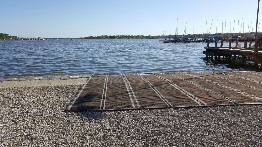 Mobi-mat walkway crossing a rocky shoreline and extending to the water