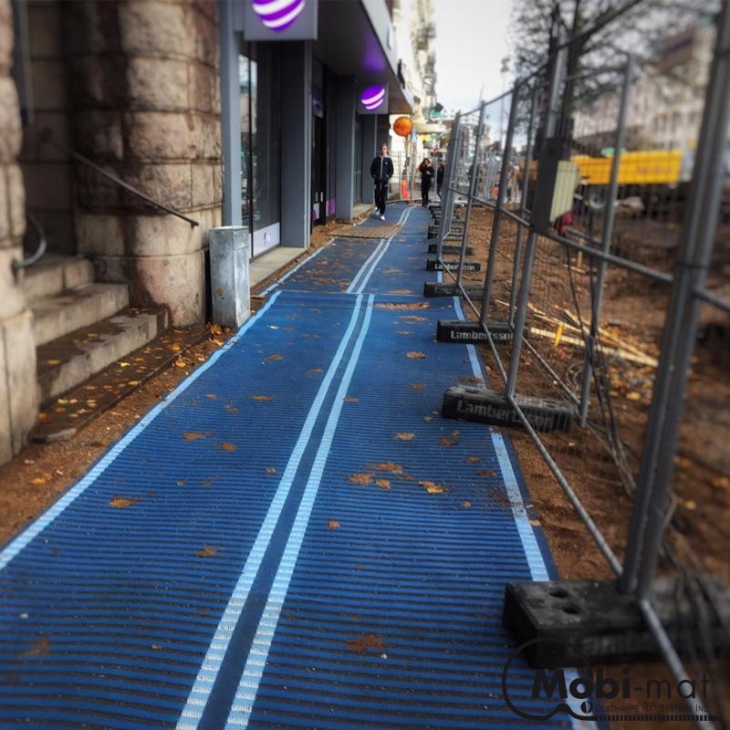 https://shop.mobi-mat.com/cdn/shop/products/portable-detour-sidewalk-mat-5-ft-wide-diversion-pathway-type-afx-blue-jay-33-286_800x.jpg?v=1601977952